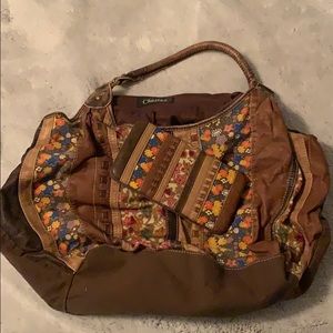 Slightly used chateau bag with a matching wallet